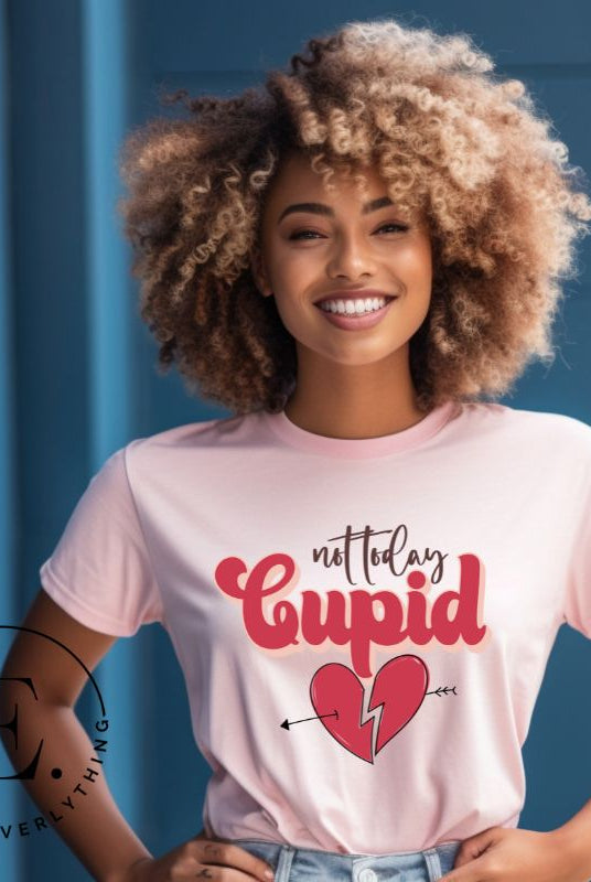 Spice up your Valentine's Day with our edgy shirt featuring a broken heart pierced by an arrow, and the defiant phrase "Not Today Cupid" on a light pink shirt. 