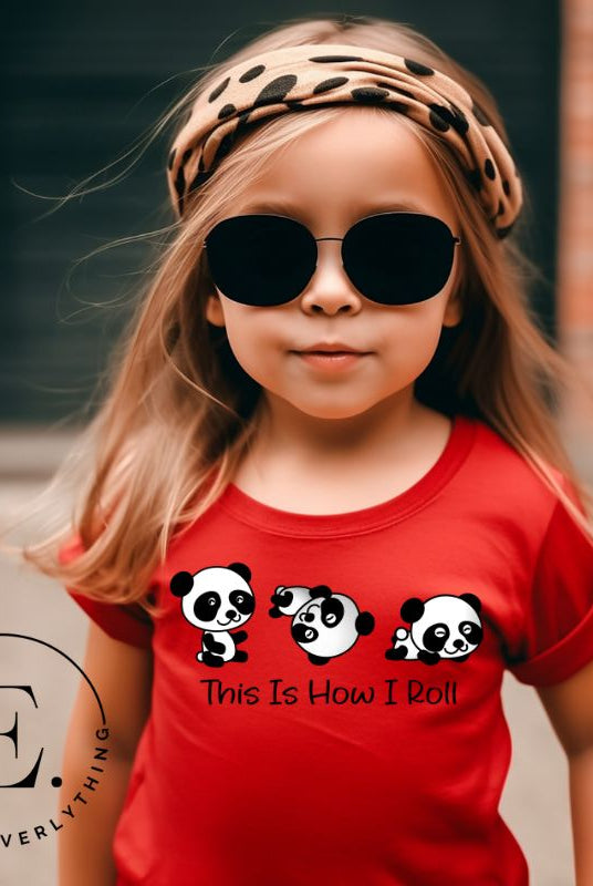 Roll into cuteness with our kids' shirt! Featuring an adorable rolling panda bear with the saying 'This Is How I Roll,' on a red shirt. 