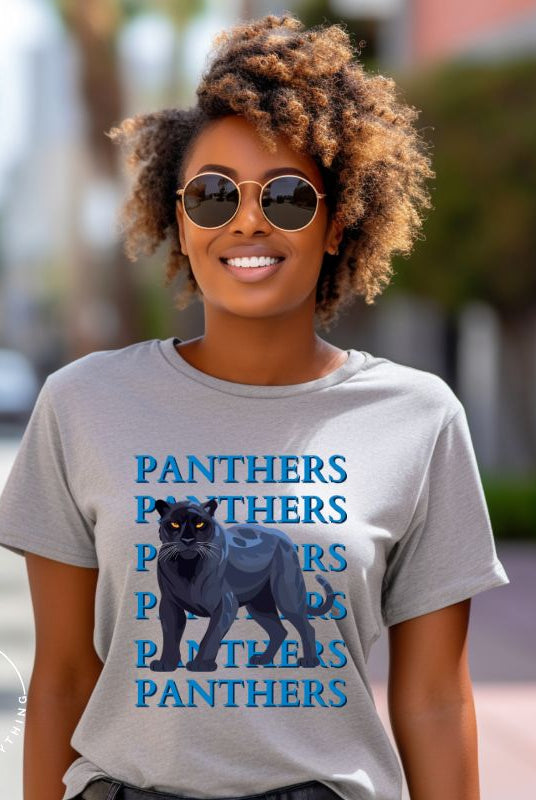 Show your Panthers pride with our Bella Canvas 3001 unisex graphic t-shirt featuring the dynamic 'Panthers Panthers Panthers Panthers' design, complete with a fierce black panther illustration on a grey shirt. 