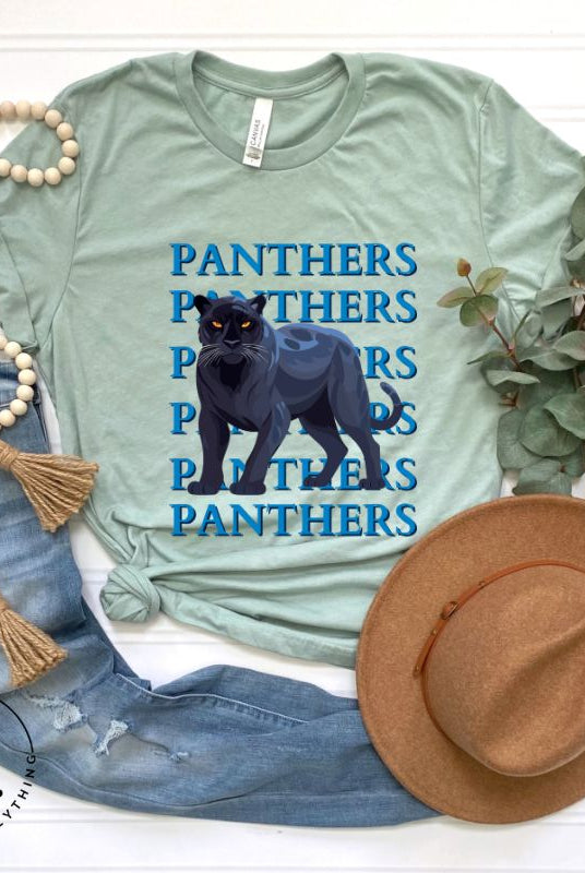 Show your Panthers pride with our Bella Canvas 3001 unisex graphic t-shirt featuring the dynamic 'Panthers Panthers Panthers Panthers' design, complete with a fierce black panther illustration on a dusty blue colored shirt. 