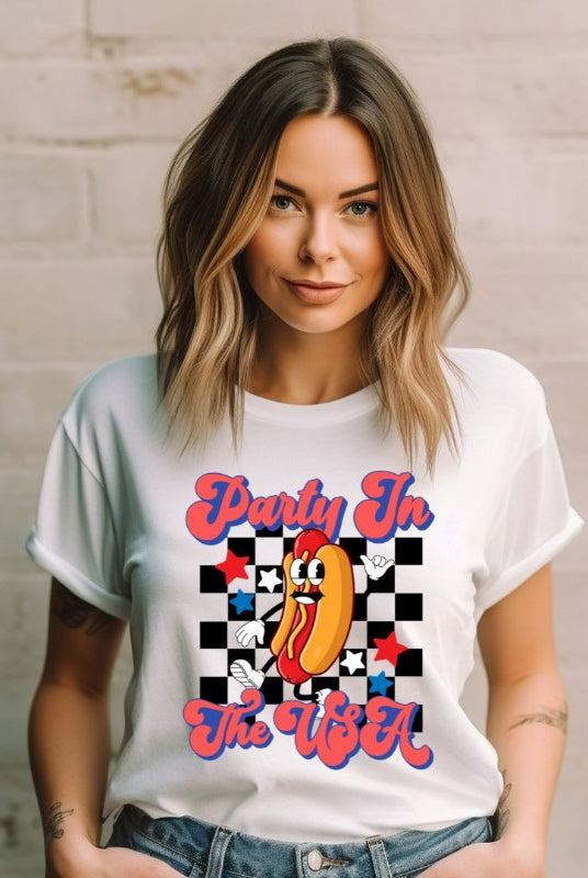 Graphic of a retro-style hotdog with a checkered background, with the text 'Party in the USA' on the front of a white graphic tee.