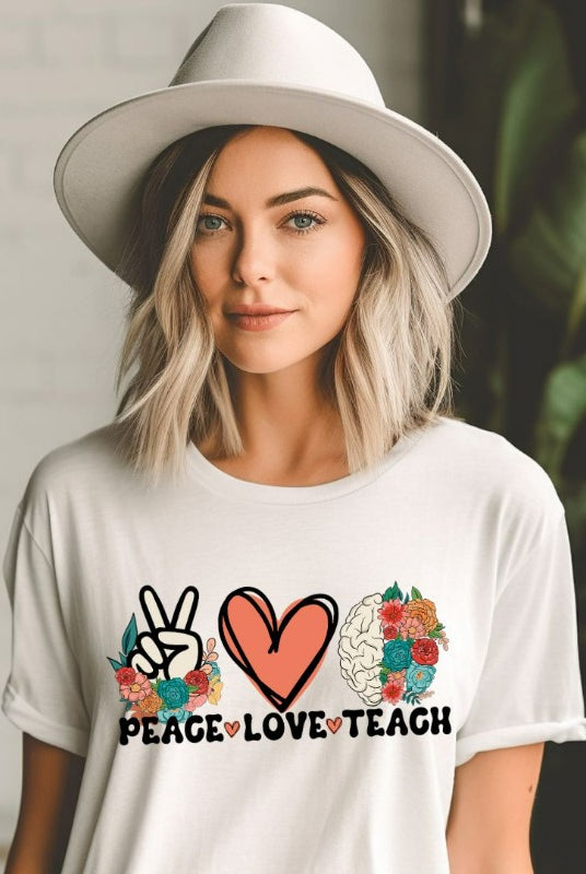 Floral design featuring the words 'peace love teach' on a teacher graphic tee - a great choice for teacher shirts and teacher gifts. White graphic tees. 