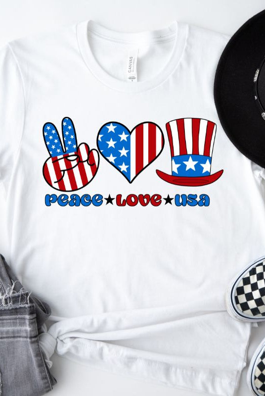 A graphic tee for the USA July 4th celebration featuring the text "peace love USA" in bold and colorful letters. The design is centered and surrounded by stars and stripes, capturing the patriotic spirit of Independence Day on a white graphic tee.