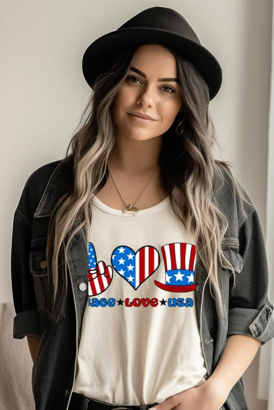 A graphic tee for the USA July 4th celebration featuring the text "peace love USA" in bold and colorful letters. The design is centered and surrounded by stars and stripes, capturing the patriotic spirit of Independence Day on a white graphic tee.