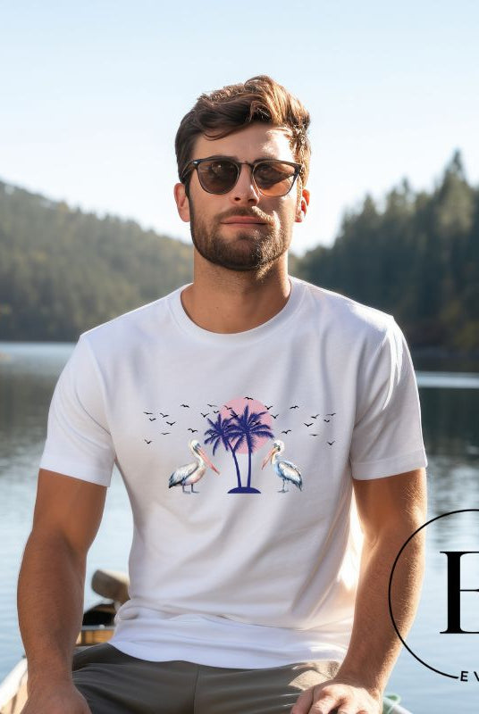 Elevate your beach style with our Beach shirt featuring two majestic pelicans facing each other. Set against a backdrop of a breathtaking sunset and a swaying palm tree on a white shirt. 