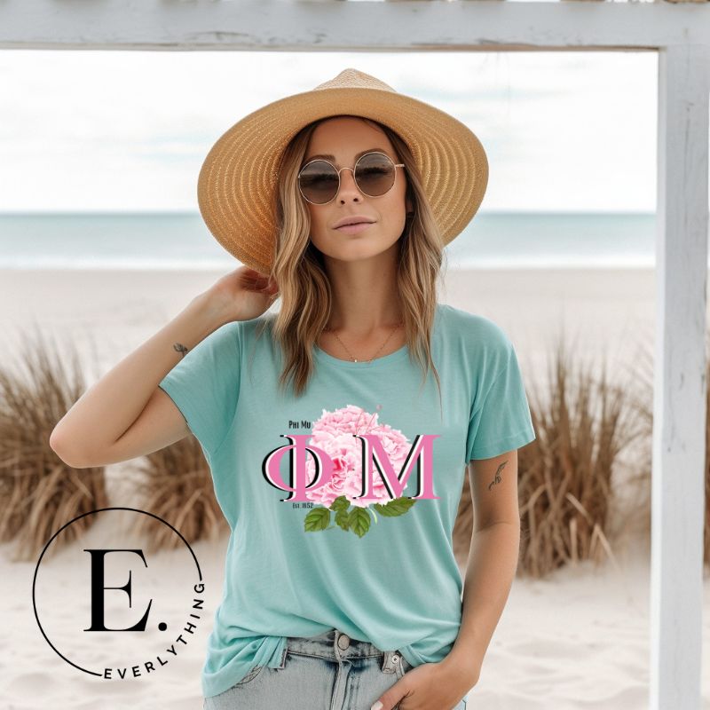 Elevate your Phi Mu sisterhood with our premium sublimation t-shirt download. Featuring the sorority's letters and the vibrant pink carnation on a teal shirt. 