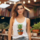 Women's racerback tank top in heather white featuring a graphic of a pineapple wearing sunglasses