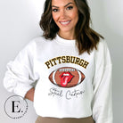 Geer up for game day with this Pittsburgh Steelers sweatshirt, featuring a football and playful lips and tongue design. Emblazoned with the team's iconic slogan "Steel Curtain" and the distinctive Pittsburgh wordmark, on a white sweatshirt. 