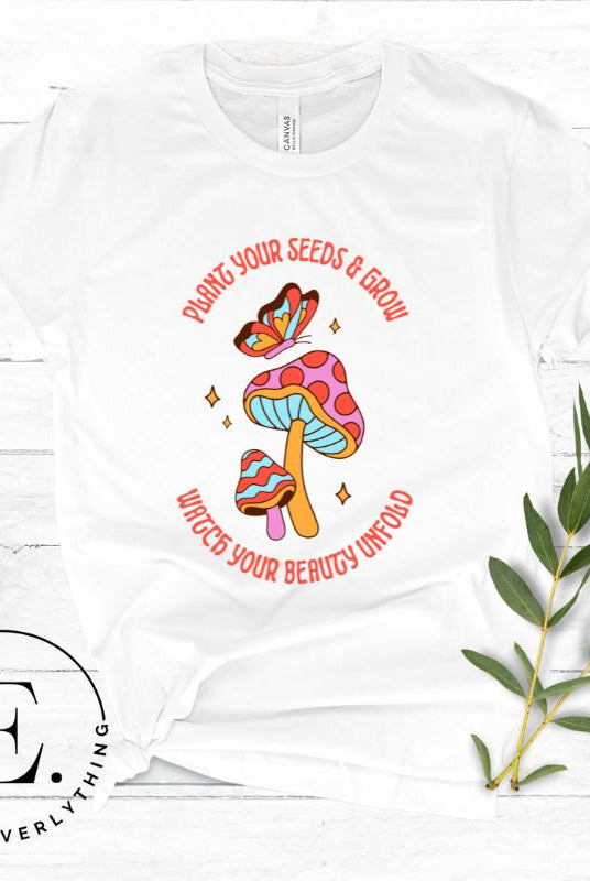 Embrace the beauty of nature with our mushroom and butterfly shirt. Featuring a captivating design of a mushroom and butterfly, it symbolizes growth and transformation. With the inspiring message "Plant your seed and grow watch your beauty unfold," on a white shirt. 