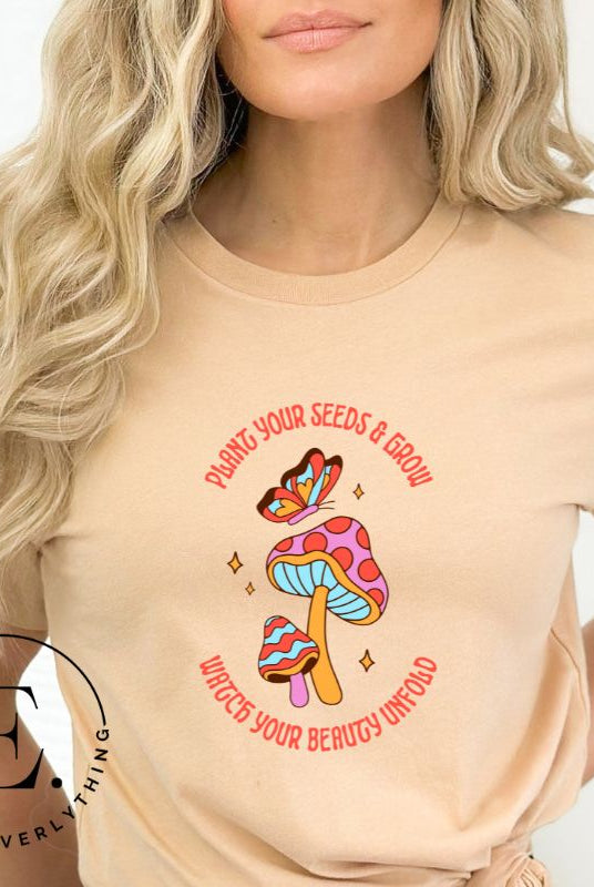 Embrace the beauty of nature with our mushroom and butterfly shirt. Featuring a captivating design of a mushroom and butterfly, it symbolizes growth and transformation. With the inspiring message "Plant your seed and grow watch your beauty unfold," on a tan shirt. 