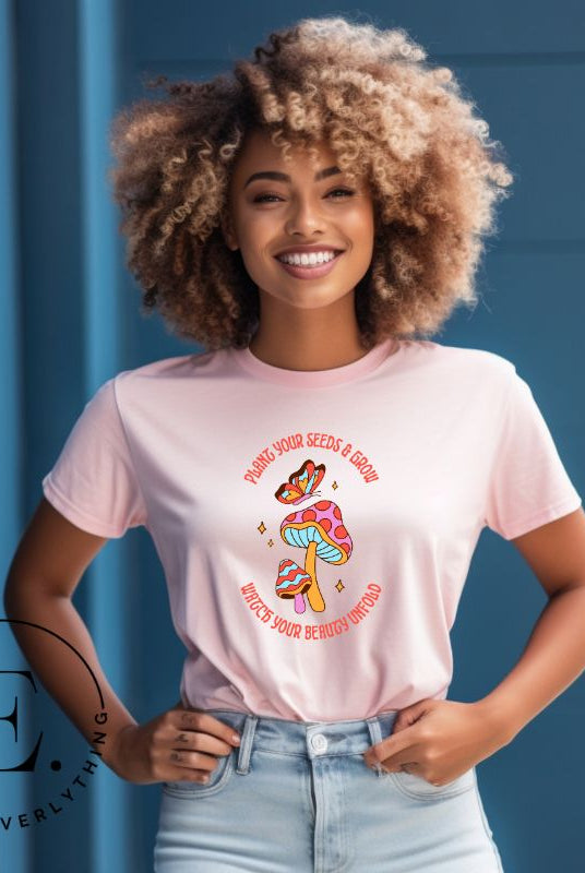 Embrace the beauty of nature with our mushroom and butterfly shirt. Featuring a captivating design of a mushroom and butterfly, it symbolizes growth and transformation. With the inspiring message "Plant your seed and grow watch your beauty unfold," on a pink shirt.