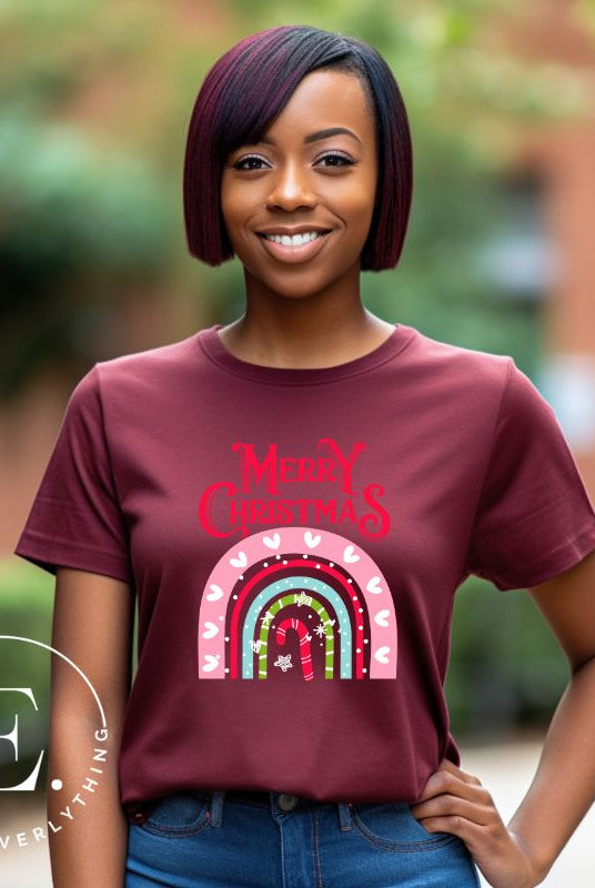 Merry Christmas rainbow candy cane and heart tee on a white shirt on a maroon shirt. 