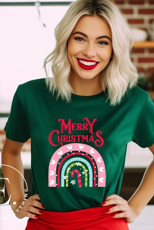 Merry Christmas rainbow candy cane and heart tee on a white shirt on a green shirt. 