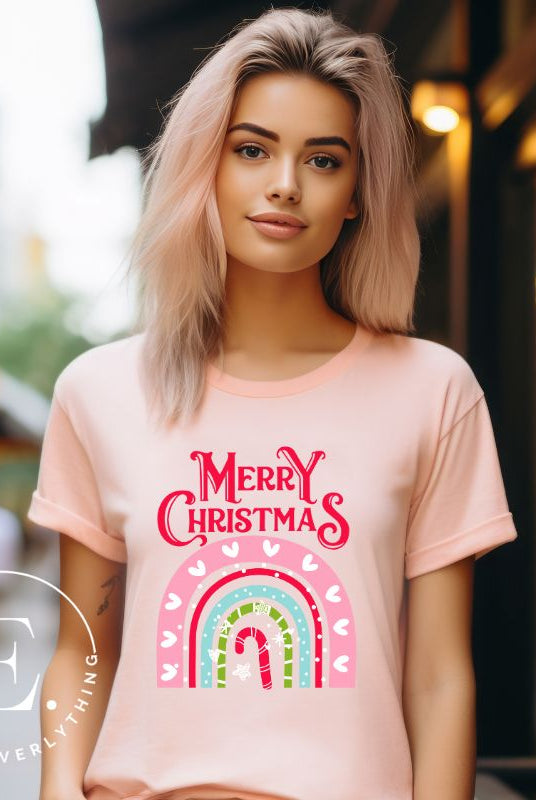 Merry Christmas rainbow candy cane and heart tee on a white shirt on a pink shirt. 