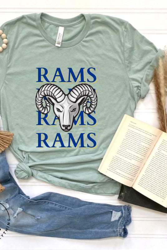 Unleash the Rams spirit with our Bella Canvas 3001 unisex tee! Elevate your game day style with the mantra 'Rams Rams Rams Rams' and a bold Rams head illustration on a dusty blue shirt. 