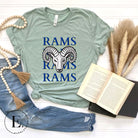 Unleash the Rams spirit with our Bella Canvas 3001 unisex tee! Elevate your game day style with the mantra 'Rams Rams Rams Rams' and a bold Rams head illustration on a dusty blue shirt. 