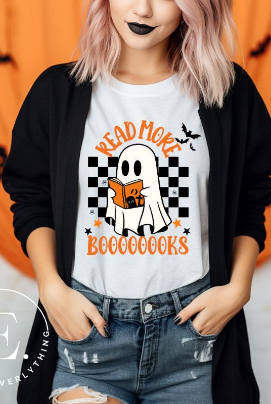 Get haunting stylish with our Halloween Ghost Reading t-shirt! Featuring a ghost engrossed in a book, it reads 'Read More Booooooks.' Perfect for bookworms and Halloween book enthusiasts on a white shirt. 