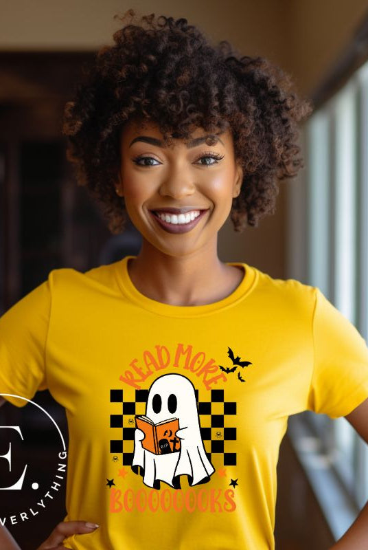 Get haunting stylish with our Halloween Ghost Reading t-shirt! Featuring a ghost engrossed in a book, it reads 'Read More Booooooks.' Perfect for bookworms and Halloween book enthusiasts on a yellow shirt. 
