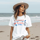 A vibrant graphic tee for the USA July 4th celebration featuring the text "Red White Blue" in bold and patriotic colors. The design is filled with various images associated with July 4th, including fireworks, American flags, stars, and stripes, evoking a sense of national pride and celebration on a white graphic tee.