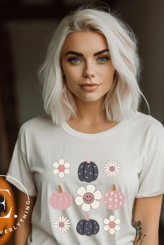 Step into retro autumn vibes with our trendy t-shirt. Featuring a delightful combination of pumpkins and retro flowers, on a white shirt. 