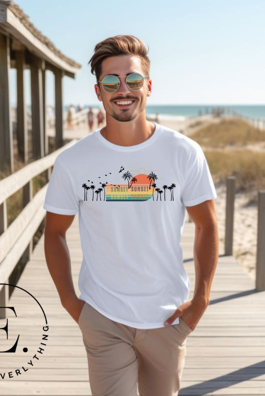 Transport yourself to a nostalgic beach getaway with our Retro Beach Shirt. Adorned with a captivating scene of a vintage sunset, palm trees, and seagulls soaring above on a white shirt. 