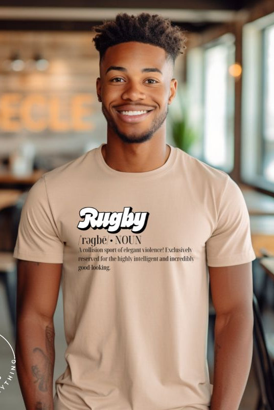 Introducing our Rugby Players Graphic T-Shirt - a perfect blend of humor, style, and a celebration of the game! This t-shirt features a witty definition that encapsulates the essence of rugby: "A collision sport of elegant violence! Exclusively reserved for the highly intelligent and incredibly good-looking," on a tan shirt. 