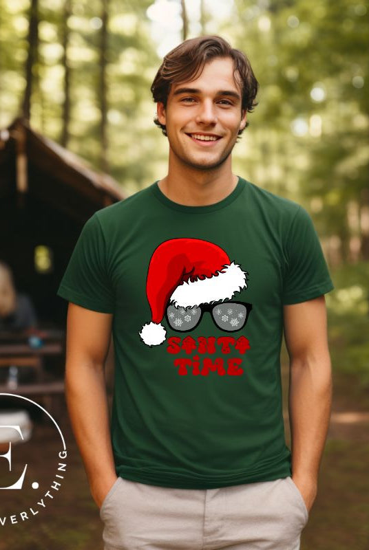 Gear up for the holiday season with our men's Christmas Shirt featuring a Santa hat, Christmas sunglasses on a green colored shirt. 