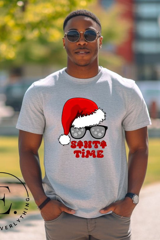 Gear up for the holiday season with our men's Christmas Shirt featuring a Santa hat, Christmas sunglasses on a grey colored shirt. 