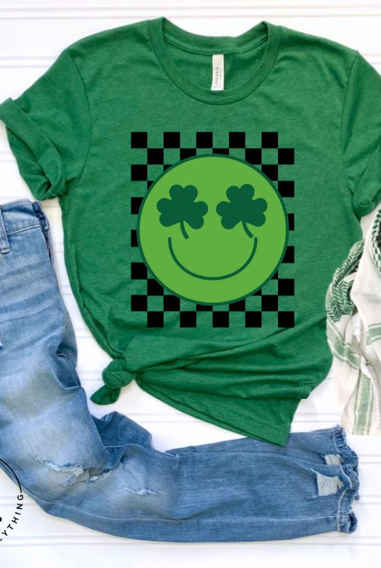 Get in the Saint Patrick's Day spirit with our Bella Canvas 3001 unisex graphic t-shirt! This unique design features a retro green smiley face with shamrock eyes, perfect for those seeking a festive and nostalgic look on a kelly green shirt. 