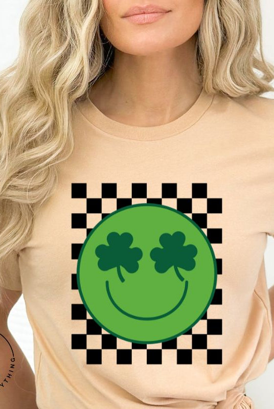 Get in the Saint Patrick's Day spirit with our Bella Canvas 3001 unisex graphic t-shirt! This unique design features a retro green smiley face with shamrock eyes, perfect for those seeking a festive and nostalgic look on a tan shirt. 