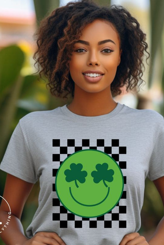 Get in the Saint Patrick's Day spirit with our Bella Canvas 3001 unisex graphic t-shirt! This unique design features a retro green smiley face with shamrock eyes, perfect for those seeking a festive and nostalgic look on a grey shirt. 