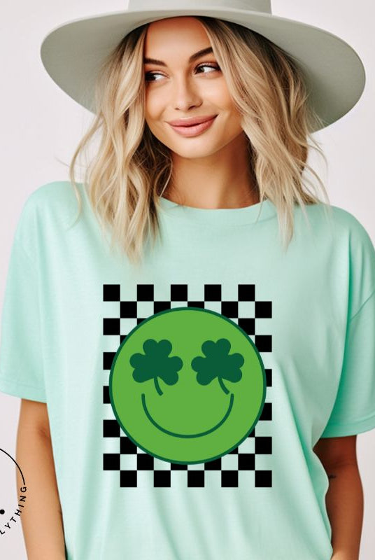 Get in the Saint Patrick's Day spirit with our Bella Canvas 3001 unisex graphic t-shirt! This unique design features a retro green smiley face with shamrock eyes, perfect for those seeking a festive and nostalgic look on a mint shirt. 