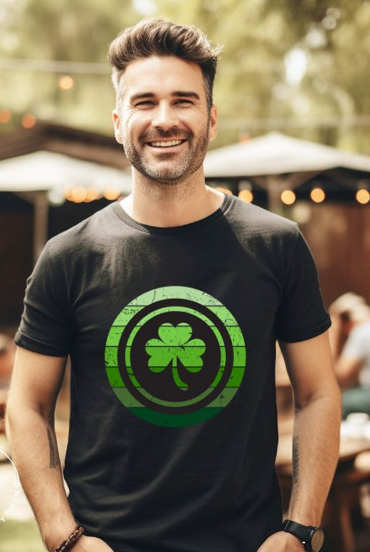 Get your ultimate Saint Patrick's Day attire with our Bella Canvas 3001 unisex graphic t-shirt! Featuring a captivating circle design in various shades of green, topped with a prominent shamrock, on a black shirt. 