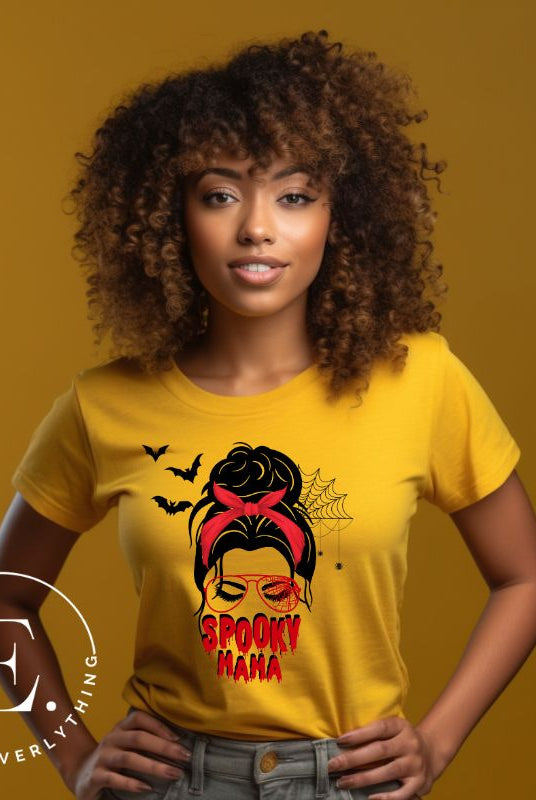 "Spooky Mama" messy bun Halloween T-shirt on yellow colored t-shirt.