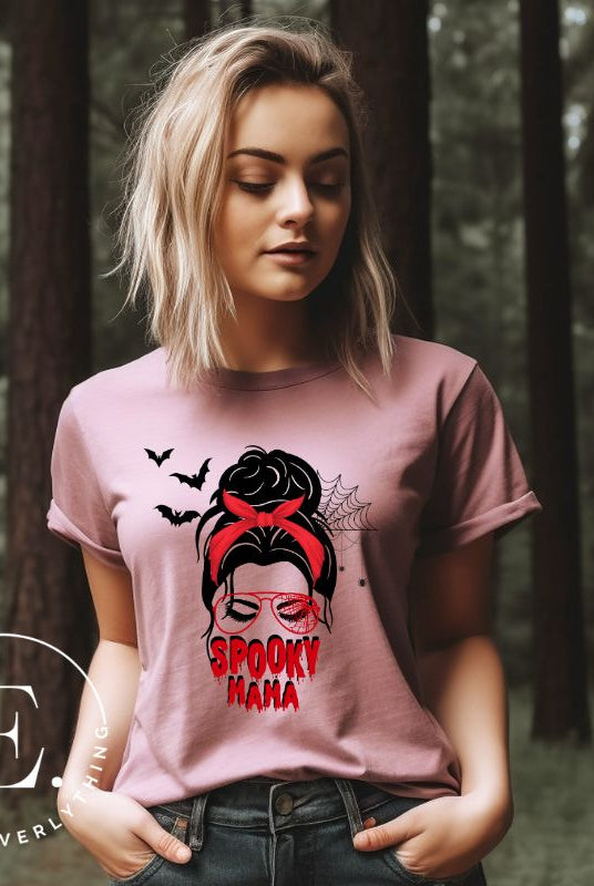 "Spooky Mama" messy bun Halloween T-shirt on pink colored t-shirt.