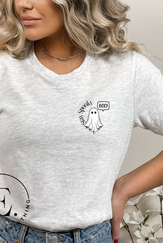 Get into the Halloween spirit with our spooktacular t-shirt. Featuring a friendly ghost holding a sign that says 'Boo' and the playful phrase "Stay Spooky"  on a grey shirt. 