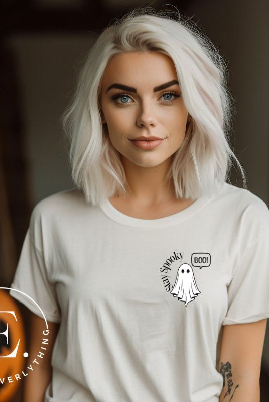 Get into the Halloween spirit with our spooktacular t-shirt. Featuring a friendly ghost holding a sign that says 'Boo' and the playful phrase "Stay Spooky"  on a white shirt. 