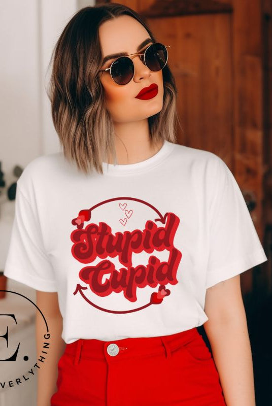Express your Valentine's Day attitude with our bold and cheeky shirt proclaiming "Stupid Cupid" on a white shirt.