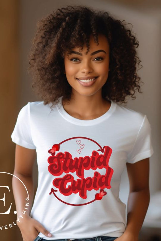 Express your Valentine's Day attitude with our bold and cheeky shirt proclaiming "Stupid Cupid" on a white shirt. 