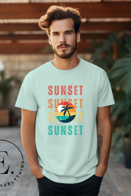 Capture the essence of tropical paradise with our Sunset t-shirt. This shirt features four rows of the word 'sunset' surrounding a stunning palm tree, bringing a laid-back, beachy vibe to your wardrobe with this mint shirt. 