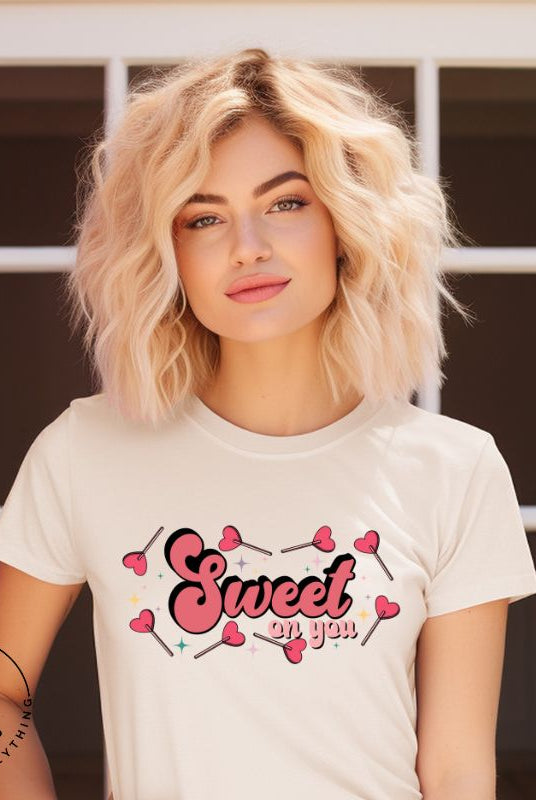 Spread the love with our charming Valentine's Day shirt featuring the endearing phrase " Sweet on You" surrounded by heart lollipops on a soft cream shirt. 
