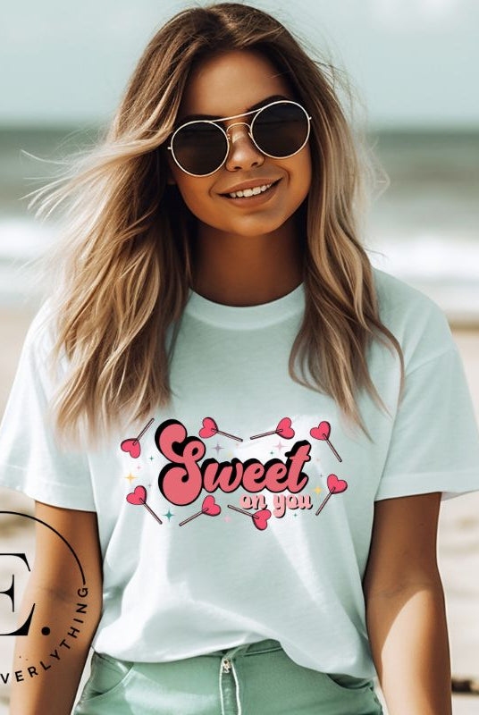 Spread the love with our charming Valentine's Day shirt featuring the endearing phrase " Sweet on You" surrounded by heart lollipops on an ice blue shirt. 
