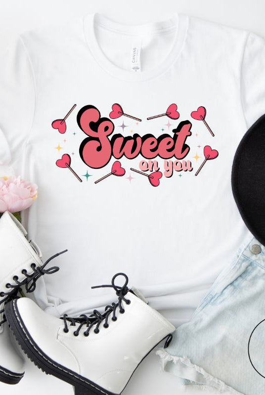 Spread sweetness this Valentine's Day with our PNG sublimation digital download! Create an adorable shirt adorned with heart lollipops and the charming saying "Sweet On You." Example of Sweet On You PNG sublimation digital download on a white shirt. 