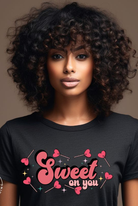 Spread sweetness this Valentine's Day with our PNG sublimation digital download! Create an adorable shirt adorned with heart lollipops and the charming saying "Sweet On You." Example of Sweet On You PNG sublimation digital download on a black shirt. 