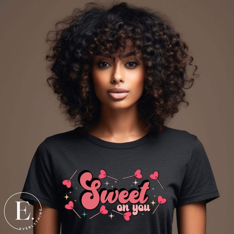 Spread sweetness this Valentine's Day with our PNG sublimation digital download! Create an adorable shirt adorned with heart lollipops and the charming saying "Sweet On You." Example of Sweet On You PNG sublimation digital download on a black shirt. 
