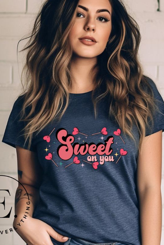 Spread sweetness this Valentine's Day with our PNG sublimation digital download! Create an adorable shirt adorned with heart lollipops and the charming saying "Sweet On You." Example of Sweet On You PNG sublimation digital download on a navy shirt. 