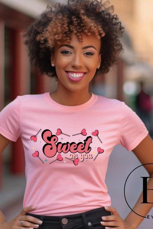 Spread sweetness this Valentine's Day with our PNG sublimation digital download! Create an adorable shirt adorned with heart lollipops and the charming saying "Sweet On You." Example of Sweet On You PNG sublimation digital download on a pink shirt. 