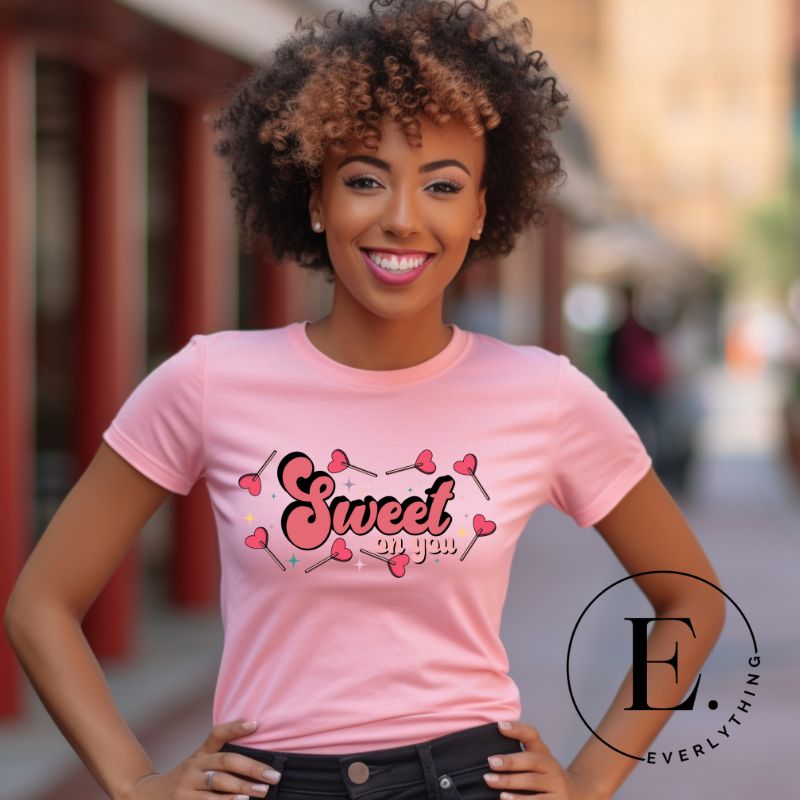 Spread sweetness this Valentine's Day with our PNG sublimation digital download! Create an adorable shirt adorned with heart lollipops and the charming saying "Sweet On You." Example of Sweet On You PNG sublimation digital download on a pink shirt. 
