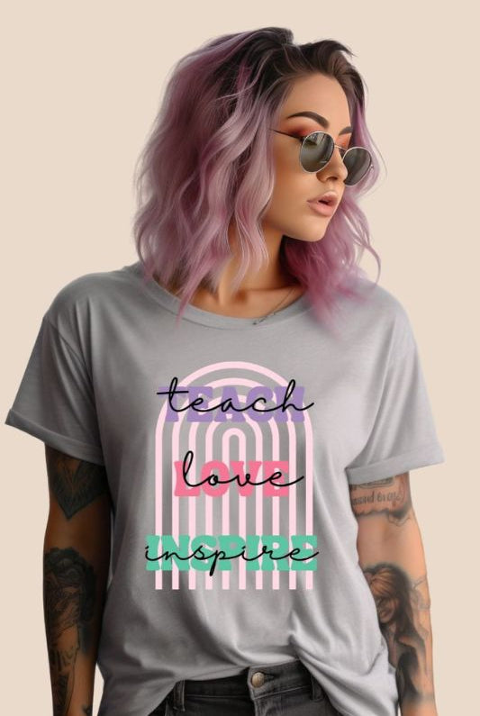 Boho rainbow design featuring the words 'teach love inspire' on a teacher graphic tee, ideal for teacher shirts and teacher gifts. Grey graphic tees.