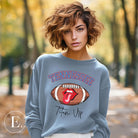 Elevate your game-day look with this Tennessee Titans sweatshirt, featuring a football and unique lips and tongue design. Complete with the team's rallying cry "Titan Up" and the iconic Tennessee wordmark, on a light blue sweatshirt. 